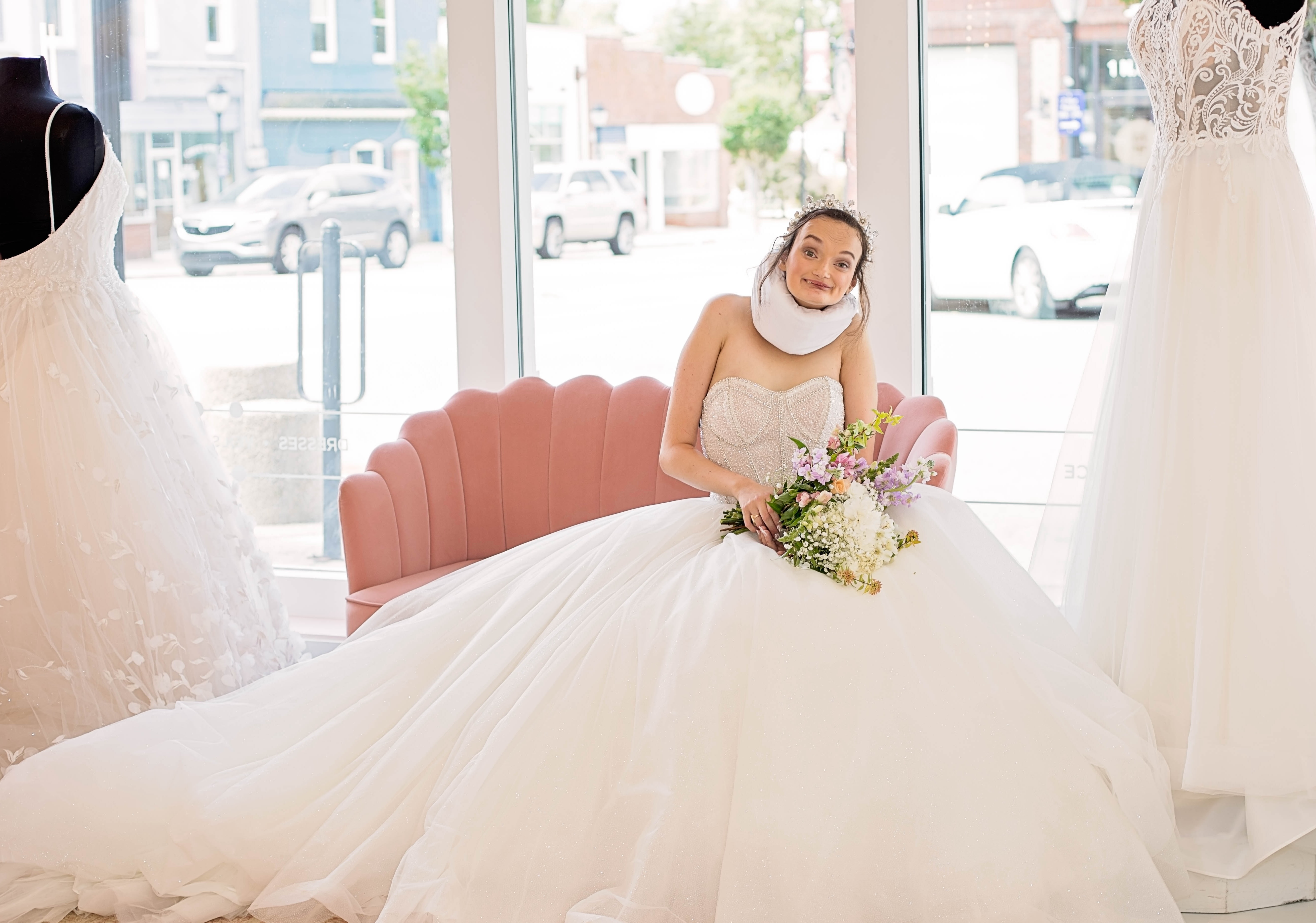 A model in a wedding dress poses with flowers. Above this is the text 'Making Bridal Accessible' and 'Providing high quality accessibility training to bridal stores in pursuit of disability justice' and a button that reads 'contact us'